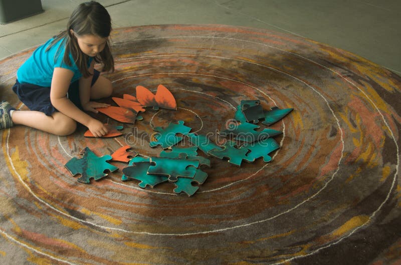 Child with jigsaw puzzle