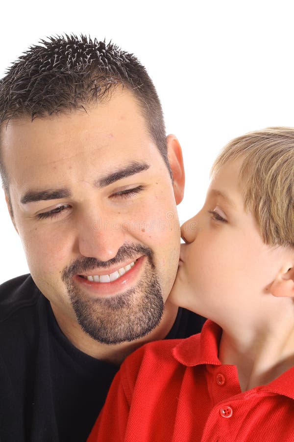 Child kissing dad on the cheek