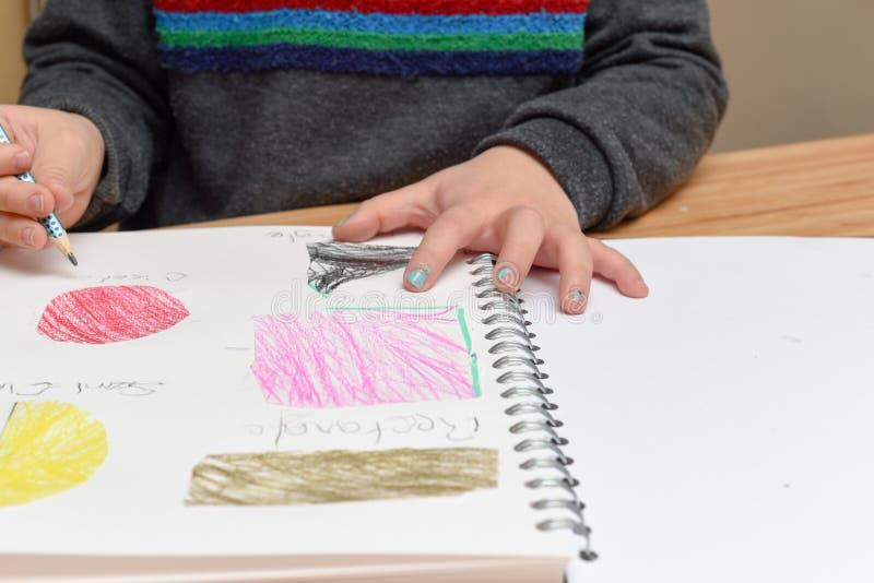 Child Learning at Home. Pre School Age Child Learning about Shapes and