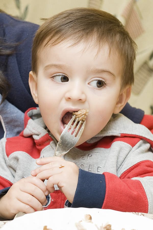 A child learning to eat. stock image. Image of equip - 18984663