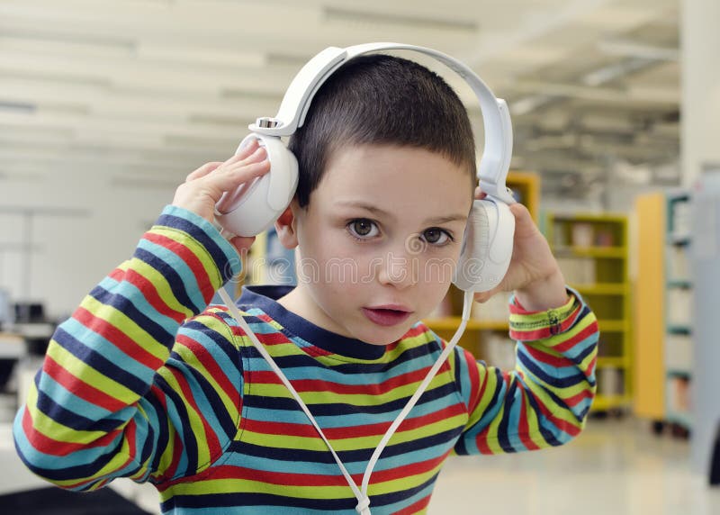 Child listening with headphones