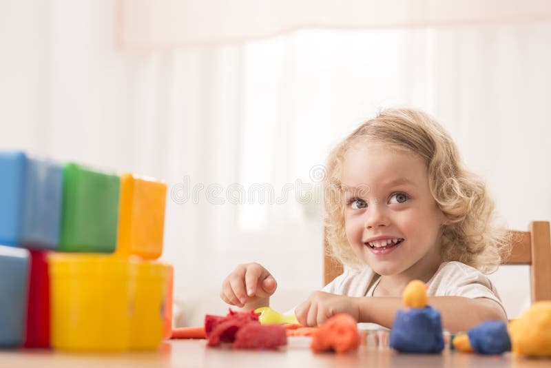 Child making toys using plasticine royalty free stock photography Child making toys using plasticine royalty free stock photography