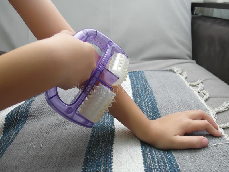 The Child Massages Himself with a Massage Device Stock Image Image of