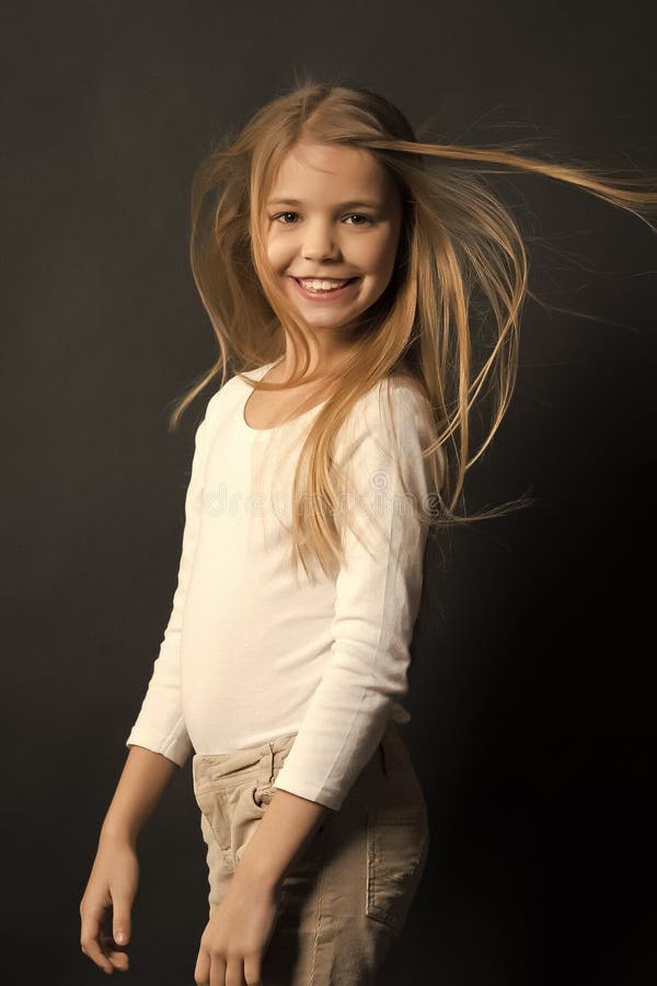 Child Model Smiling with Blowing Long Hair Stock Image - Image of preteen,  beautiful: 132588575