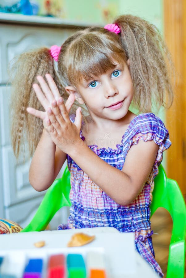 The child molds from clay royalty free stock photos