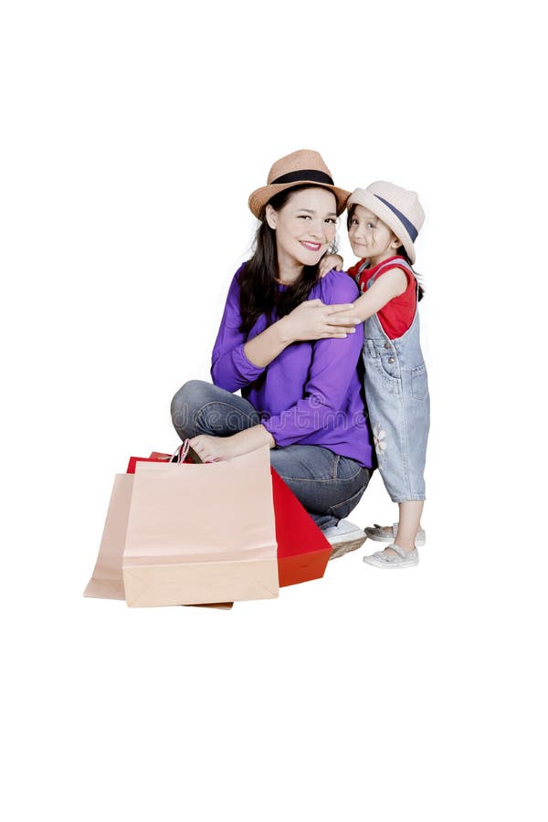 Child and mother with shopping bags on studio royalty free stock photo Child and mother with shopping bags on studio royalty free stock photo