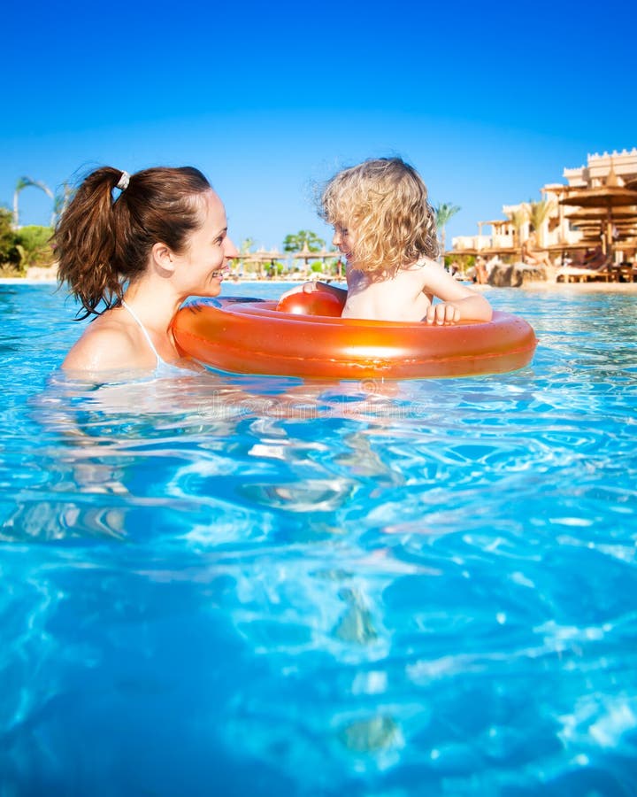 Child with mother in swimming pool royalty free stock photography Child with mother in swimming pool royalty free stock photography