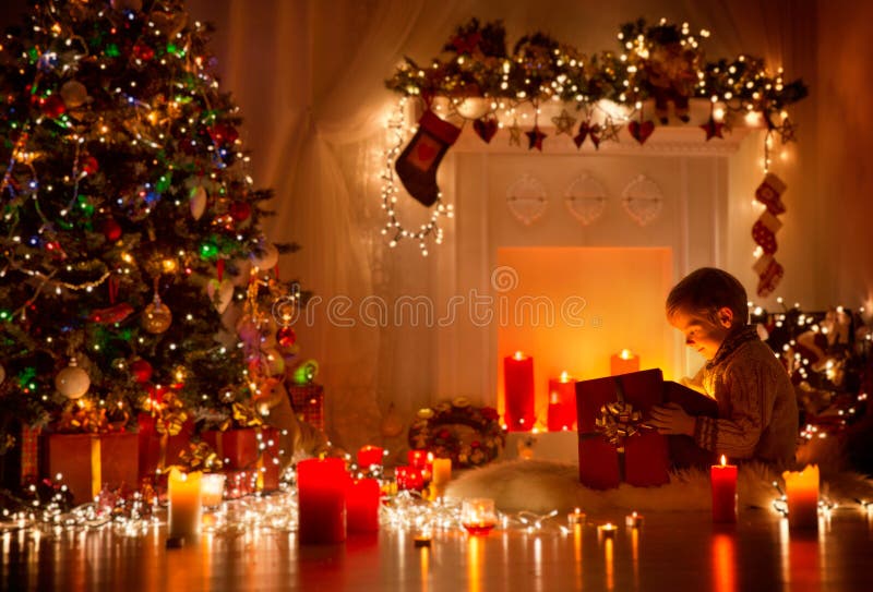 Child Opening Christmas Present, Kid Looking to Light Gift Box royalty free stock photos Child Opening Christmas Present, Kid Looking to Light Gift Box royalty free stock photos