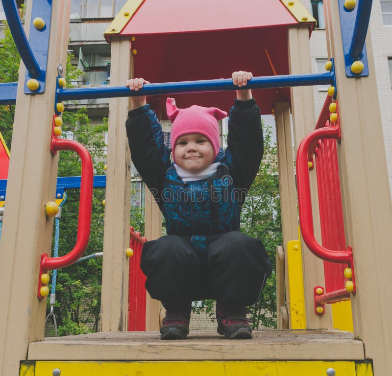 The child overcomes obstacles playing on the Playground stock images The child overcomes obstacles playing on the Playground stock images