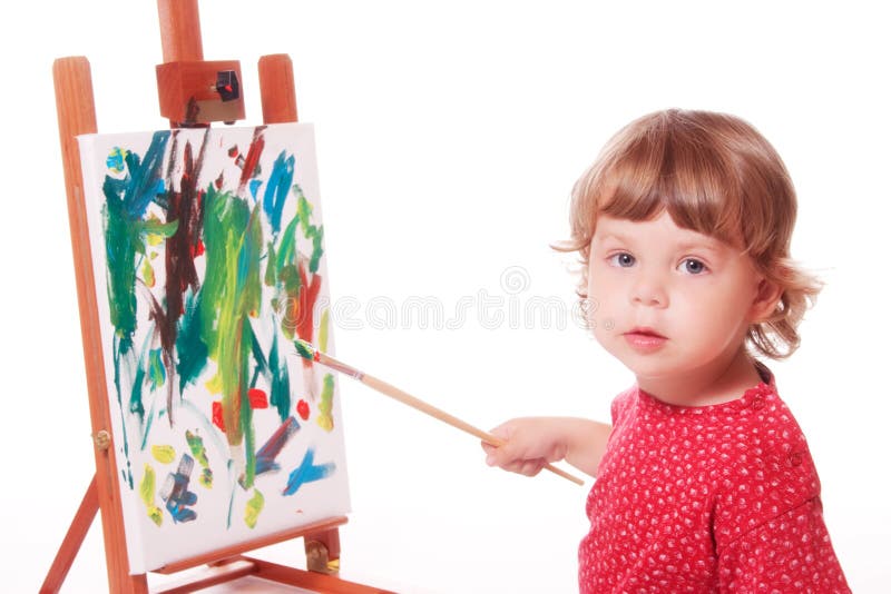 Child painting on easel