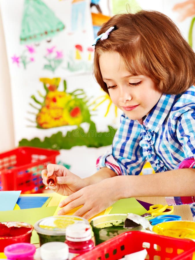 Child painting at easel. stock image. Image of painter 29083381
