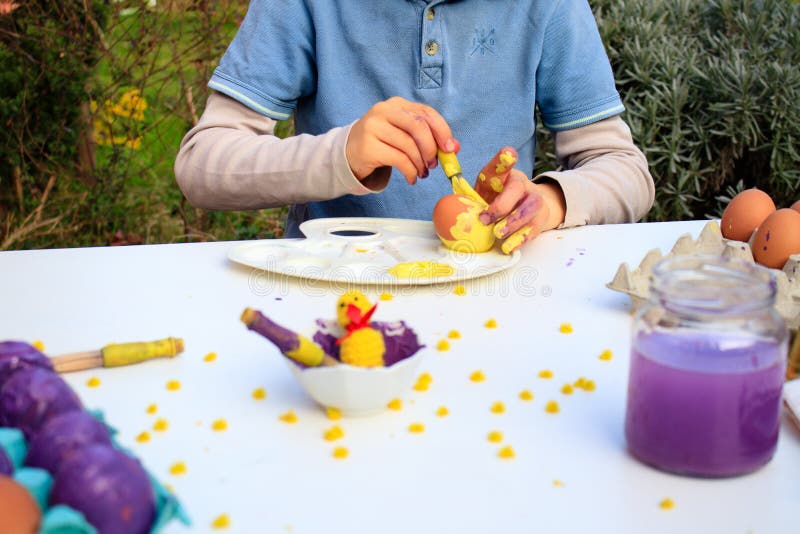 A Child Painting Easter Eggs. Easter Children Activity Stock Image