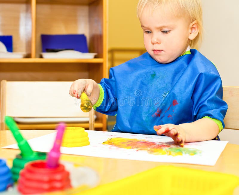 Child at painting lesson stock photo. Image of brush 17011704