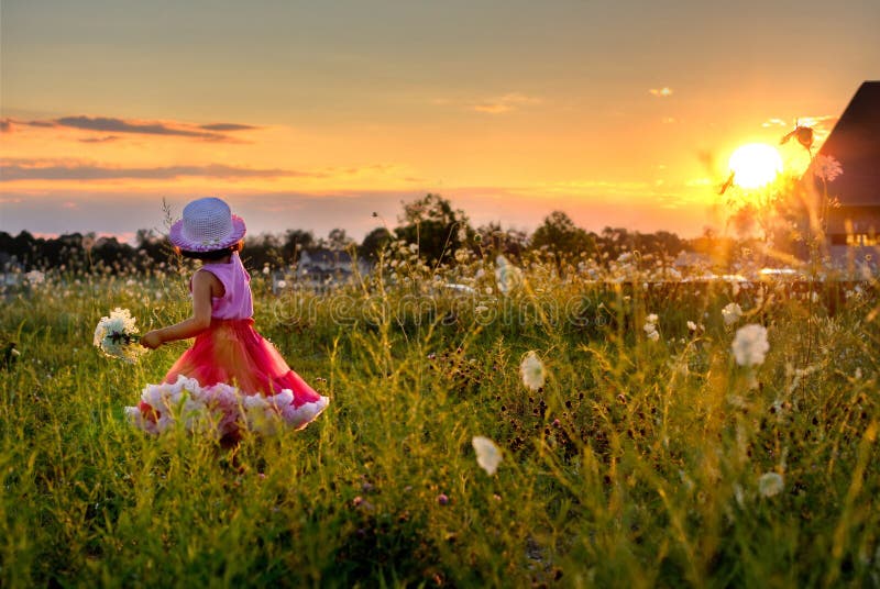 Child picking flowrs