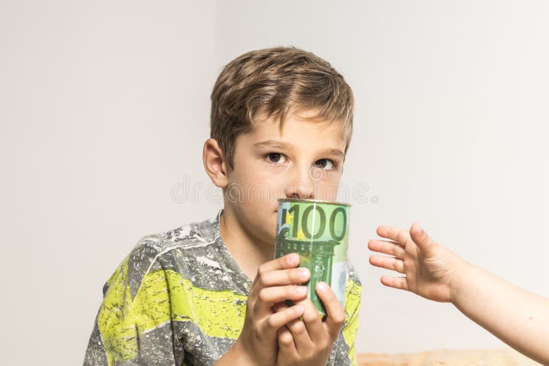 Child with a piggy bank, euro