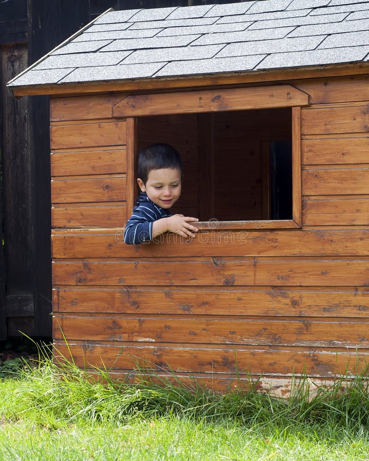 Child in play house