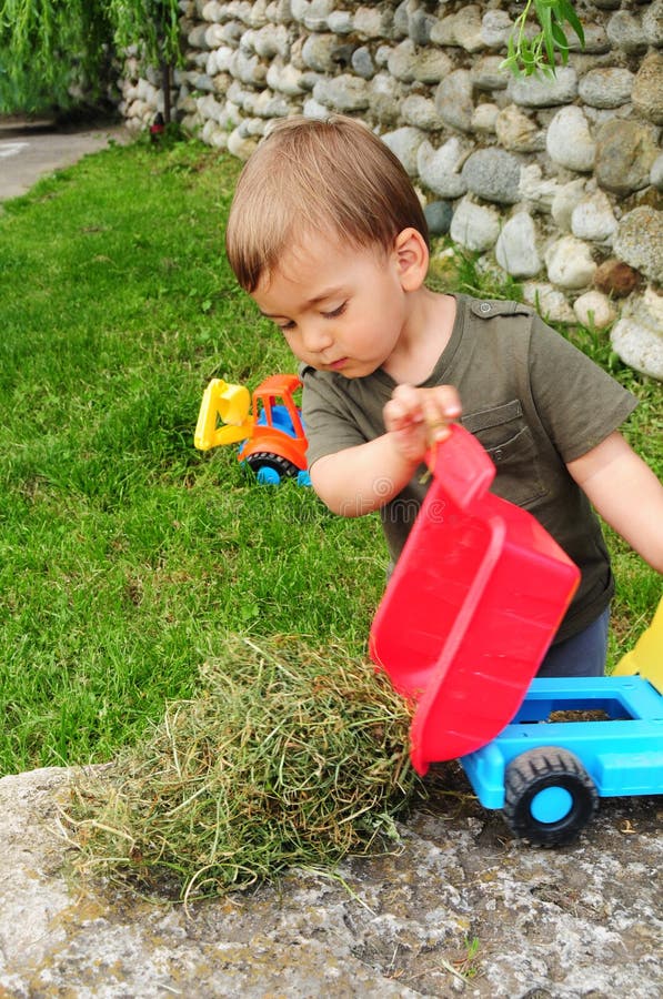 Child Playing with Dump Truck Stock Photo Image of dump, hands 40605940
