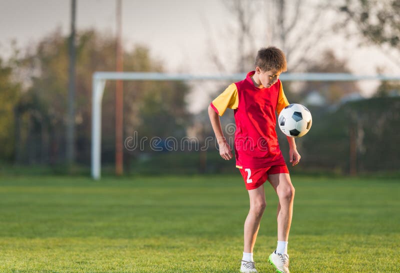 Child playing football stock photo. Image of recreational - 61835580