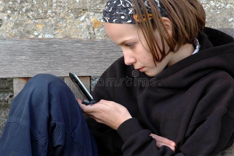 Child playing game on mobile phone