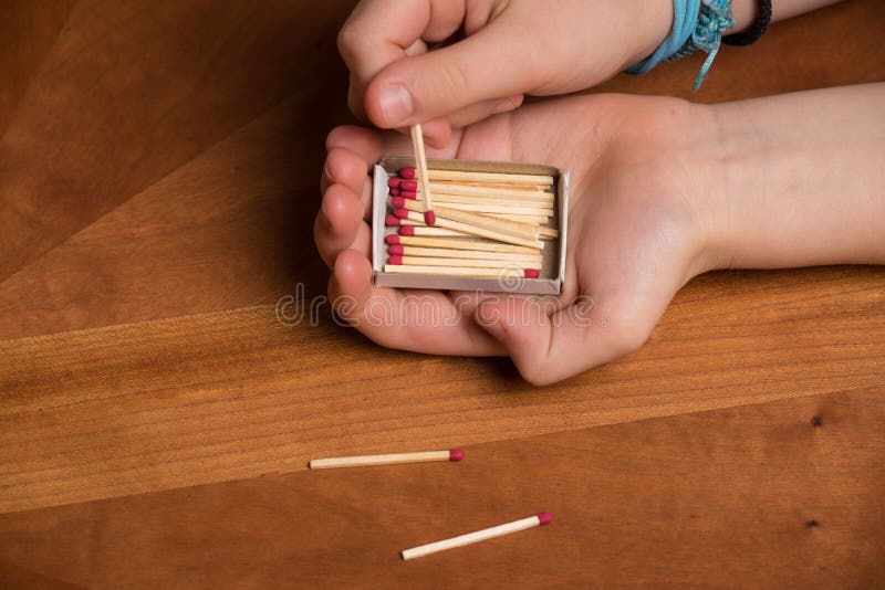 Child playing with matches