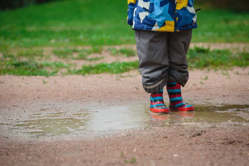 Child playing in muddy puddle royalty free stock photography Child playing in muddy puddle royalty free stock photography