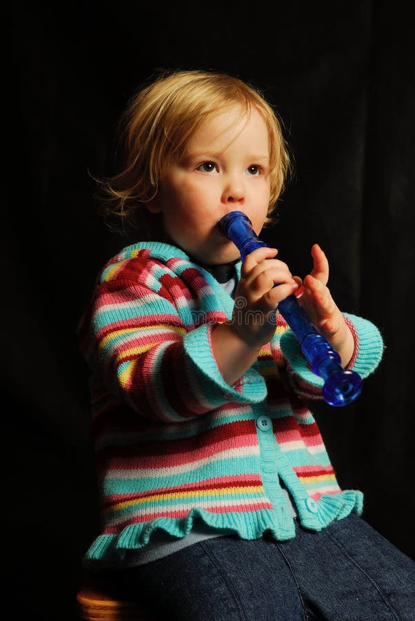 Child Playing Music on Flute Stock Image Image of child, play 1921833