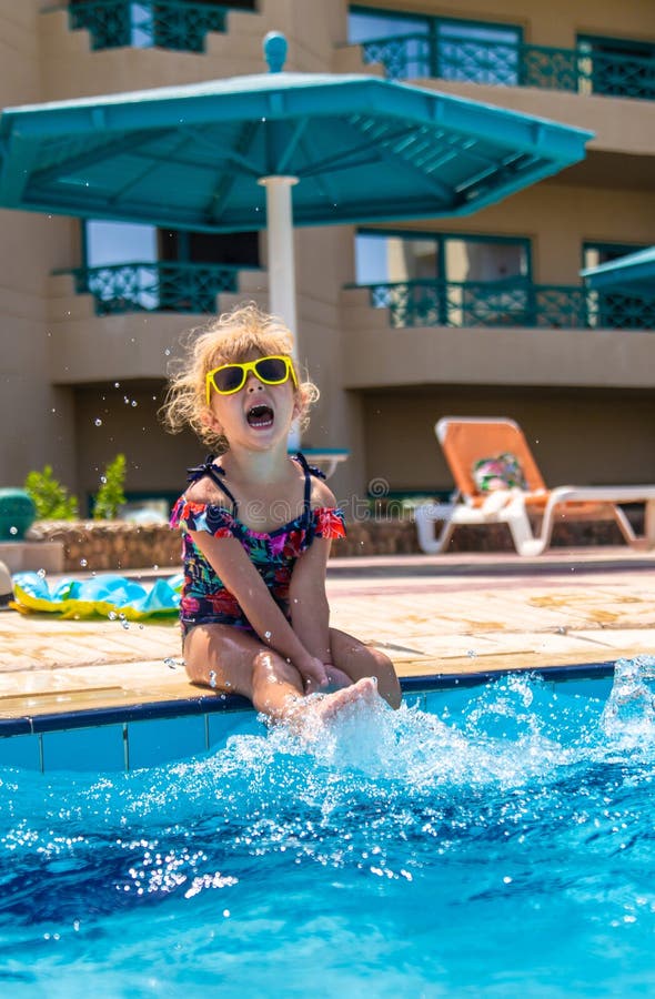 Child playing in the pool. Selective focus. royalty free stock photos