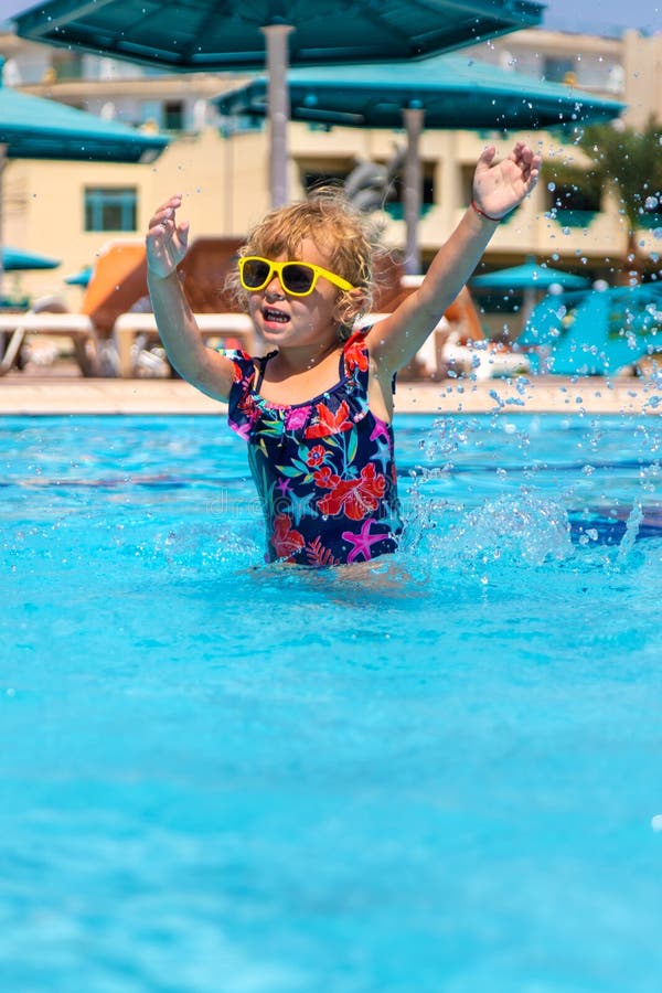 Child playing in the pool. Selective focus. stock photos