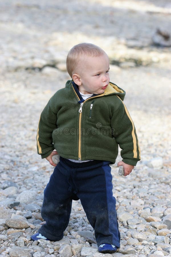 Child playing with rocks