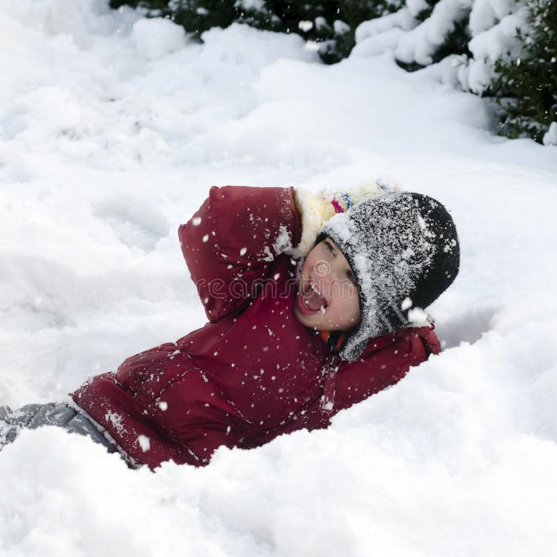 Child playing in snow