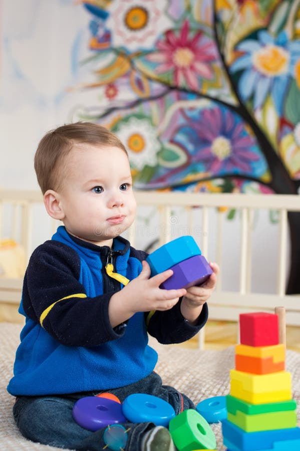 Child playing toys stock image. Image of childhood, floor - 84304865