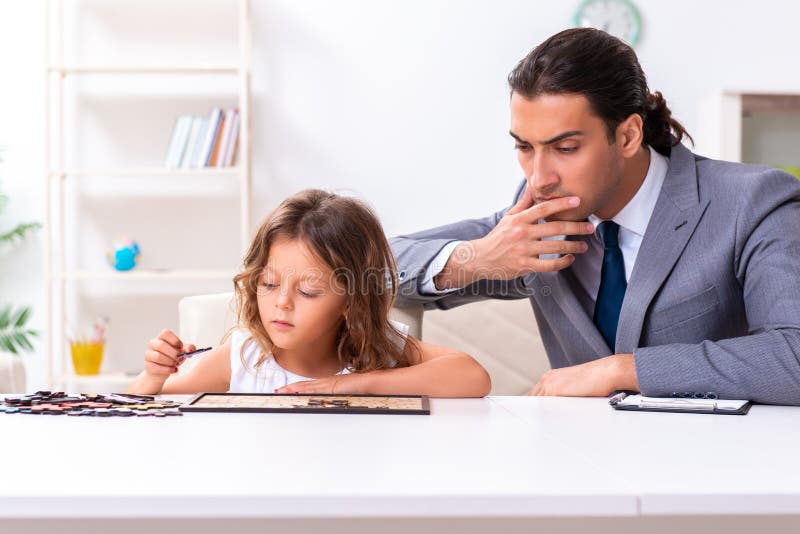 Child Psychologist Attending Small Girl Stock Photo Image of mental