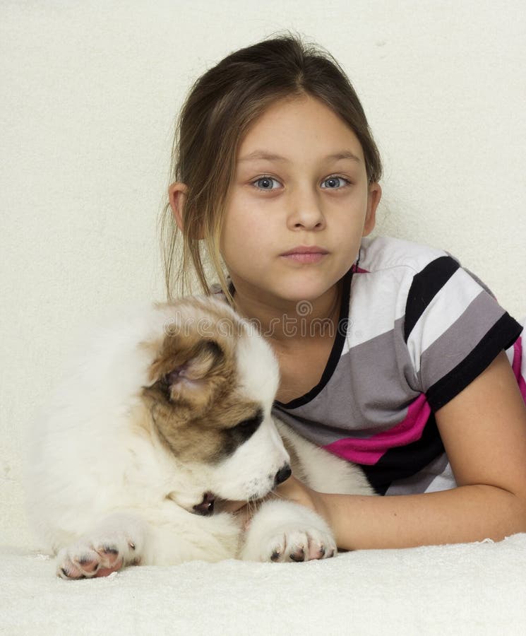 Child and puppy stock image. Image of elementary, affectionate - 48252423