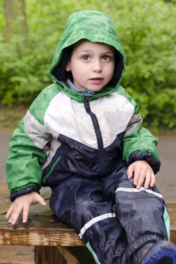 Child in rain stock image. Image of raincoat, clothing - 30455525