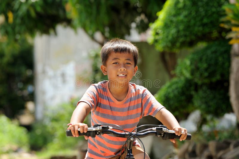 Child Riding Bicycle royalty free stock photos