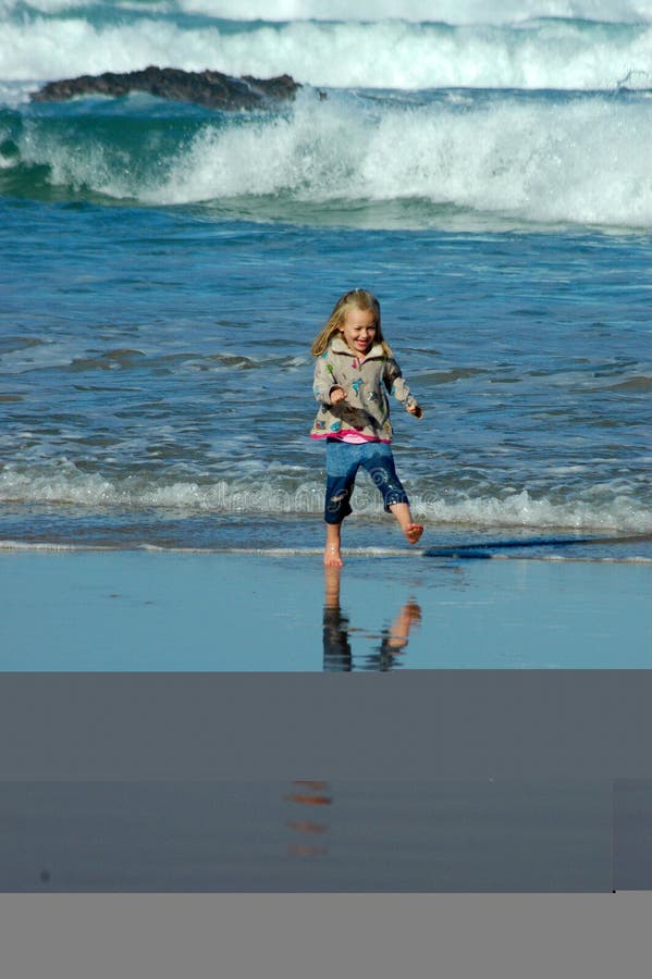 Child running in sea