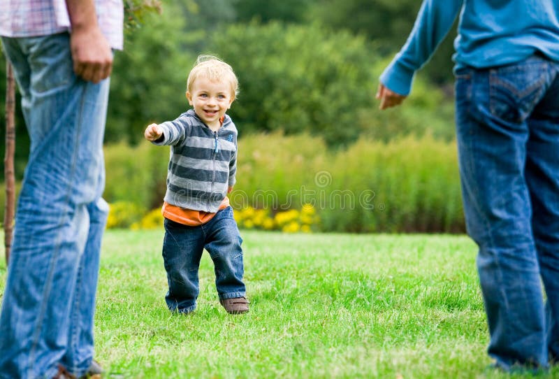 Child running to parents stock images Child running to parents stock images