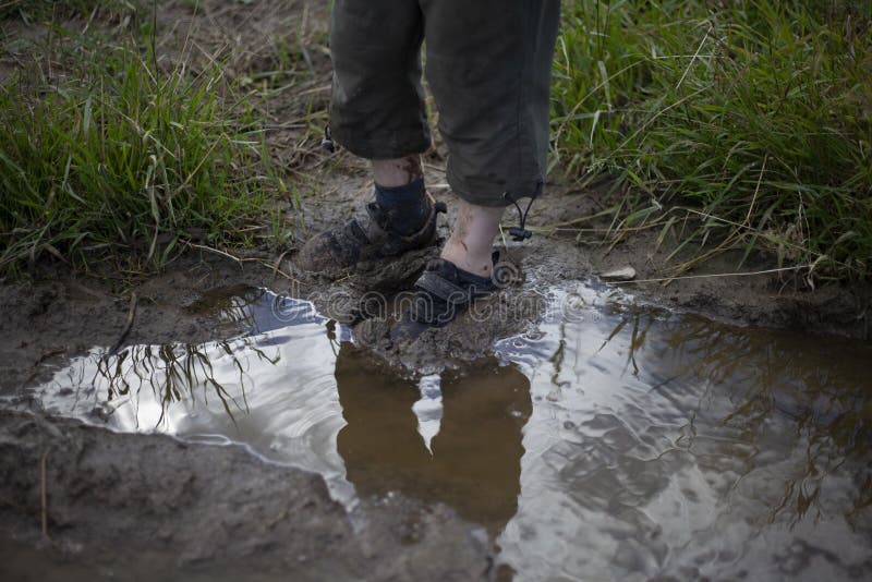 The Child`s Feet are Covered in Mud. Stock Photo - Image of naughty ...
