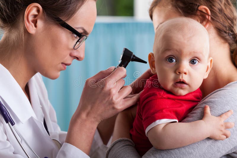 Child s otolaryngologist doing ear examination