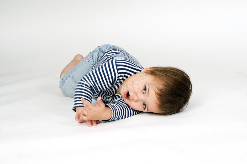 Child In Sailor's Striped Vest Lying Down Picture. Image 6329680
