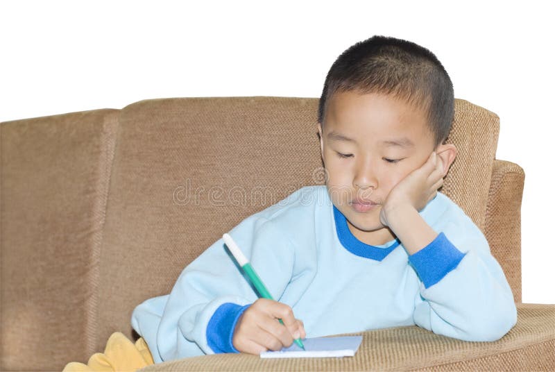 A child sit in sofa and writing