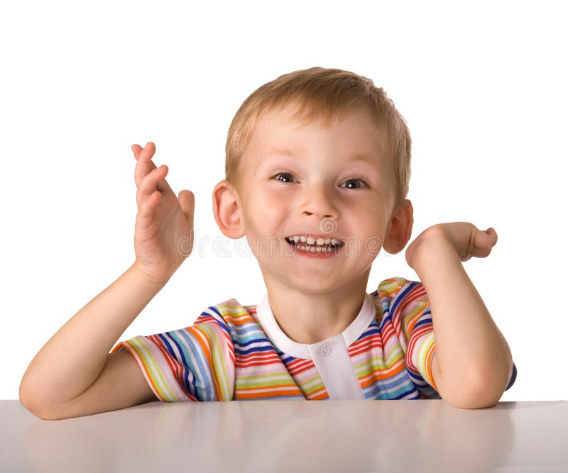 The child sits at a table