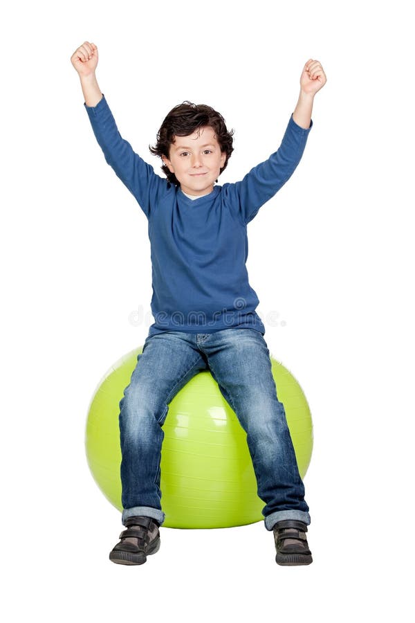 Child sitting on a pilates ball