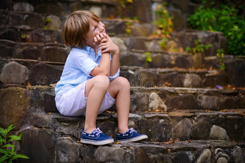 Child sitting on steps