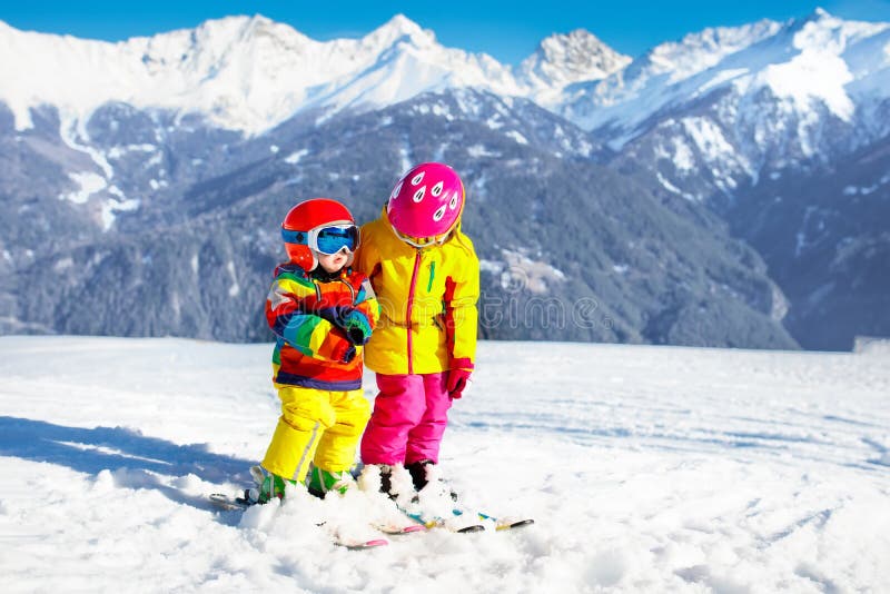 Kids winter snow sport. Children ski. Family skiing.