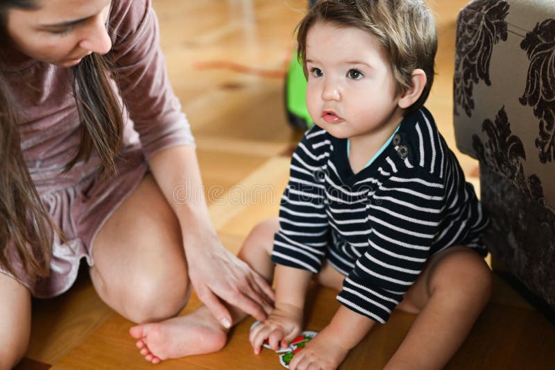 The child spends time with his mother. Baby boy and insects. Mom and baby are studying nature royalty free stock photography The child spends time with his mother. Baby boy and insects. Mom and baby are studying nature royalty free stock photography