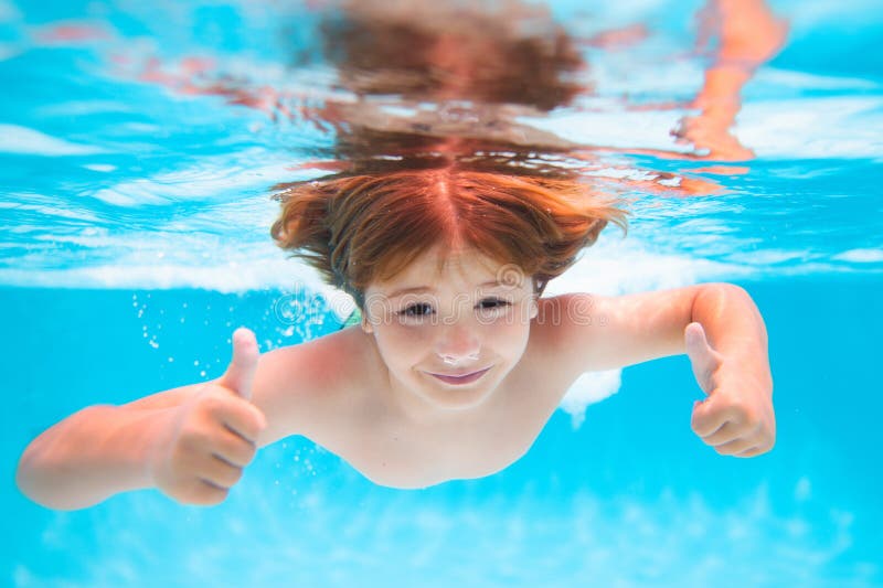 Child Splashing in Swimming Pool. Kid Swimming in Pool Underwater ...