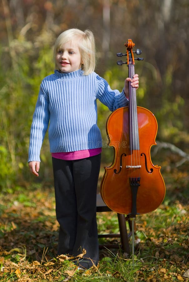Child Standing With Cello
