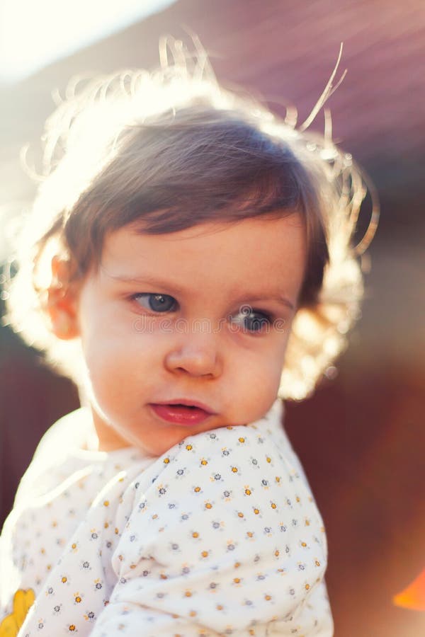 Child in sunlight looking back stock photo Child in sunlight looking back stock photo