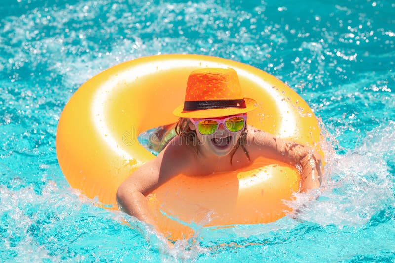Child Swim in Poolside in Water Background. Happy Kid Playing with